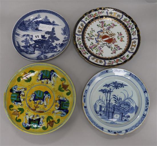 A Delft plate, an armorial plate and two others